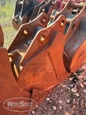 Side of used Hensley Bucket